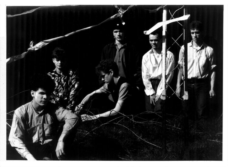 Fini Tribe in a B&W photo in an 'industrial' setting